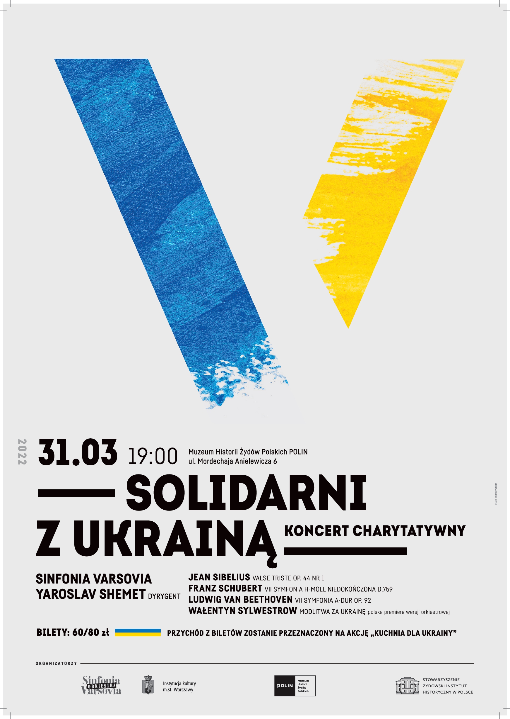 Plakat koncertu "Solidarni z Ukrainą". Na górze litera V w kolorach ukraińskiej flagi - niebiesko-żółtym - pod spodem napisy 31.03, 19.00, Solidarni z Ukrainą - koncert charytatywny.