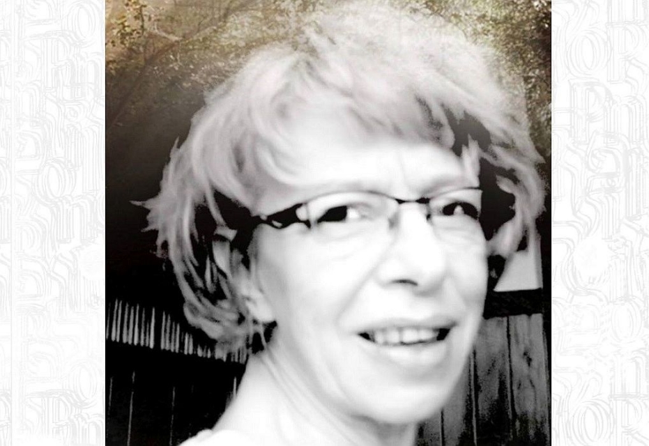 Portret Tamary Łozińskiej - w okularach, uśmiecha się.