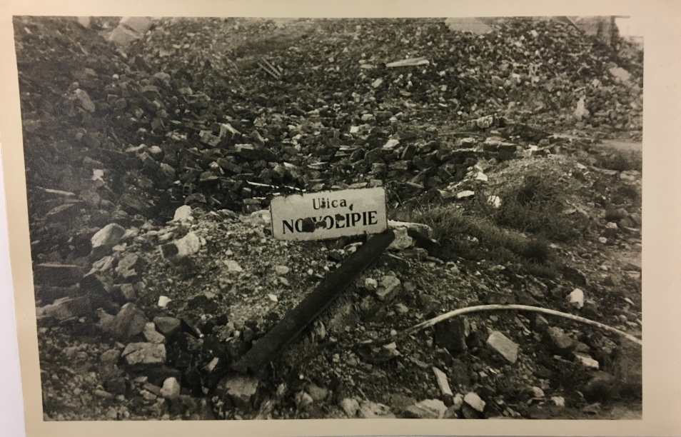 Ruins of the Warsaw Ghetto after 1943. There is ulica Nowolipie (Nowolipie Street) sign laying on the ground full of bricks.