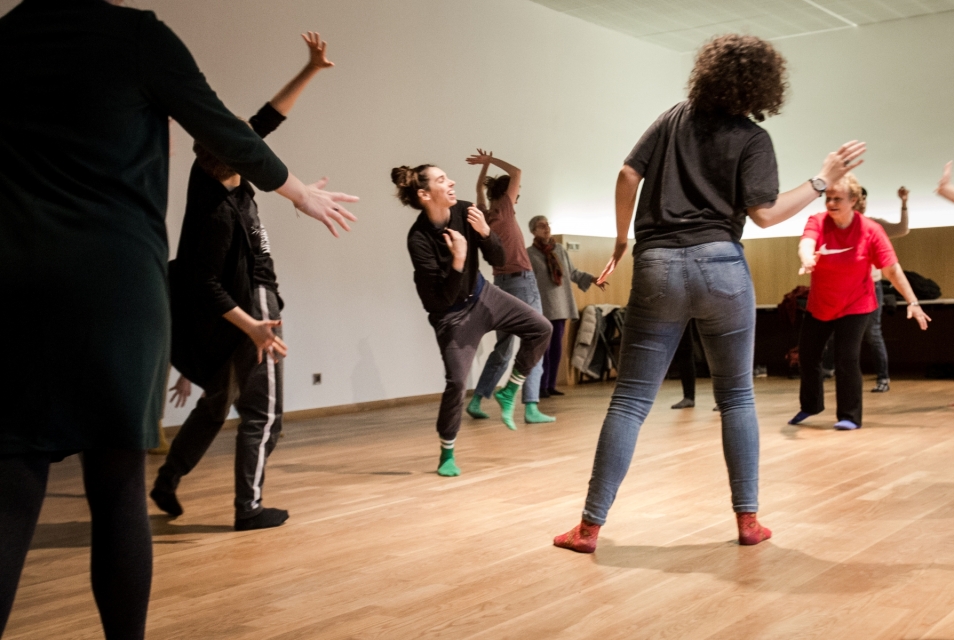 Several women in motion during the workshop.