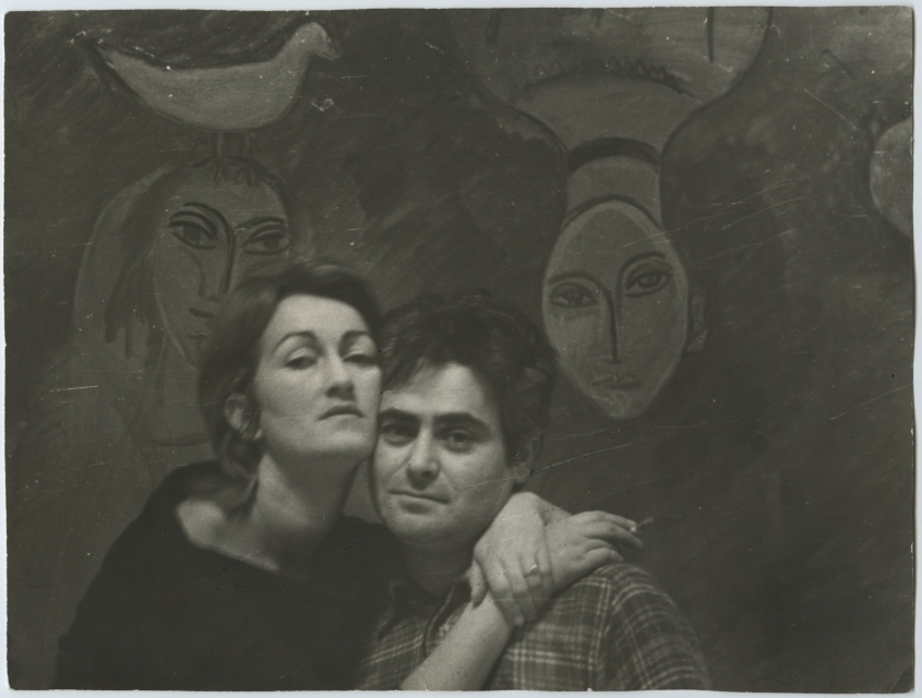 Marek Oberländer embracing his wife Halina in their studio on Solna Street. In the background is the painting "Dream of Goldfaden."