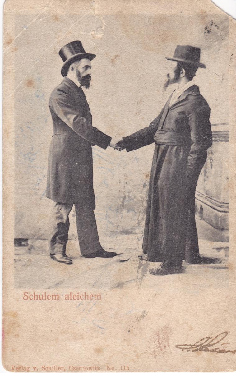 Zdjęcie dwóch Żydów ściskających sobie dłonie.